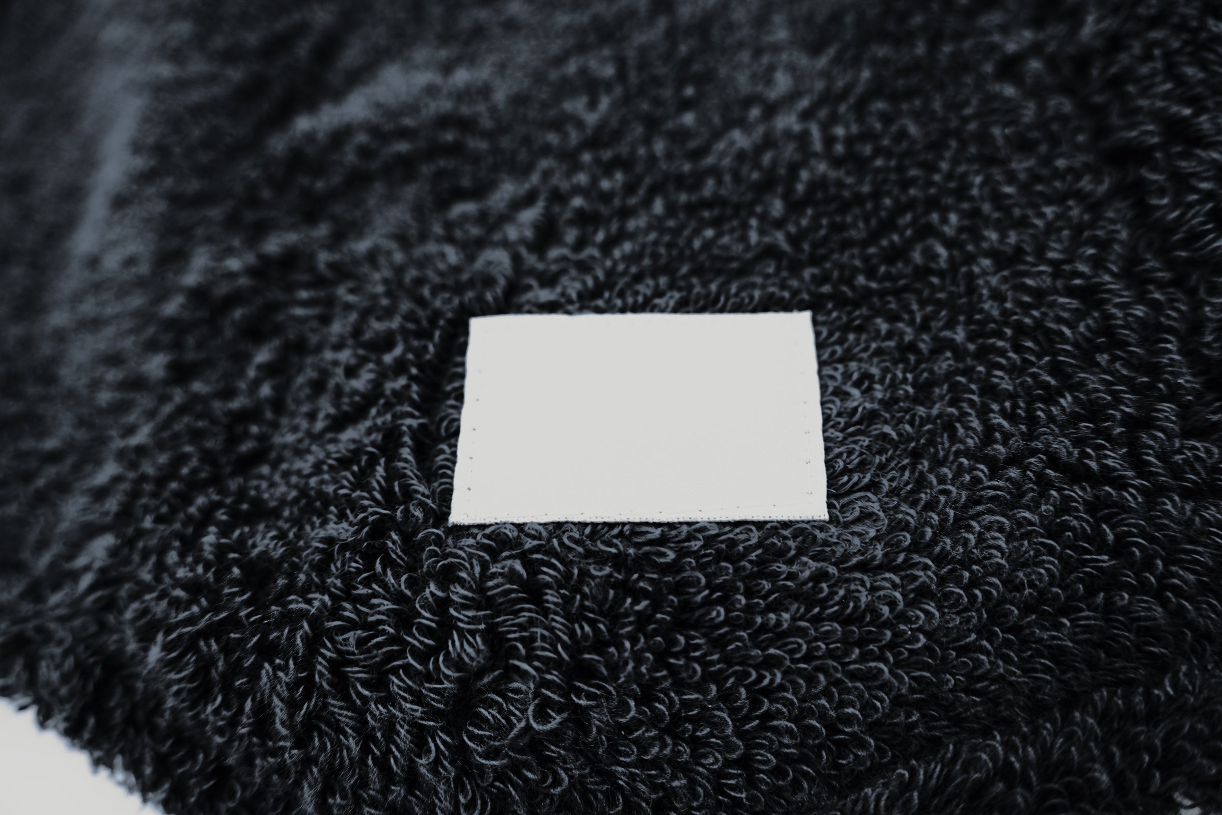 Front woven label of the Sweat Hat